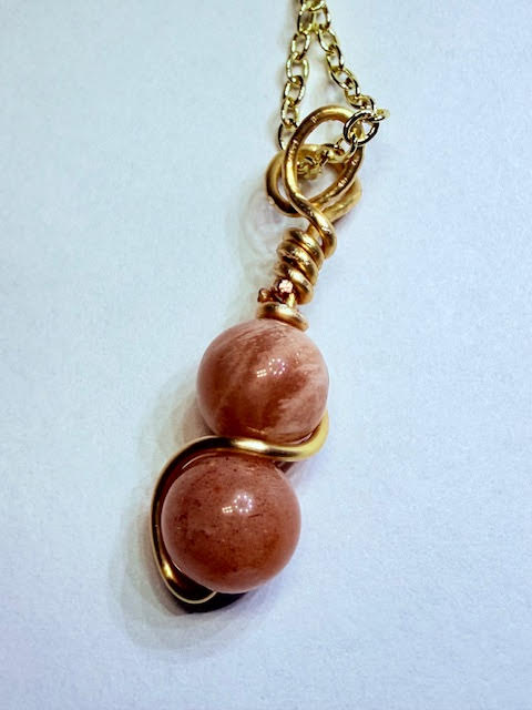 the pink lady necklace